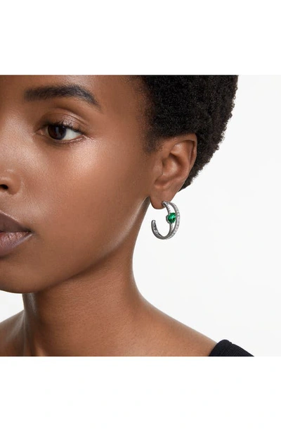 Shop Swarovski Hyperbola Hoop Earrings In Green