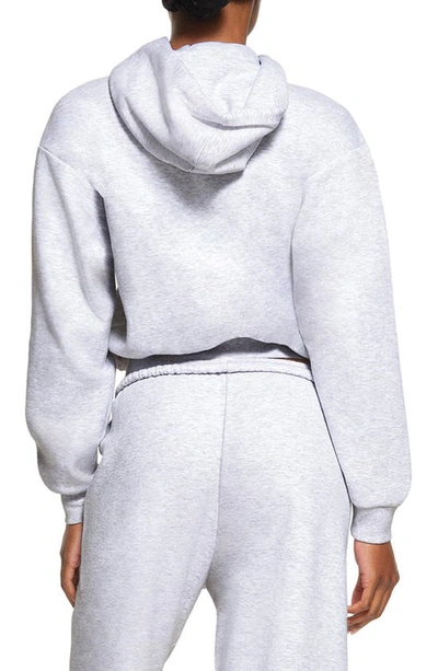 Shop Skims Cotton Blend Fleece Hoodie In Light Heather Gray