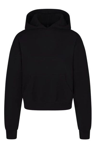 Shop Skims Cotton Blend Fleece Classic Pullover Hoodie In Onyx