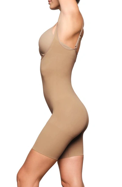 Shop Skims Open Bust Mid Thigh Bodysuit In Ochre