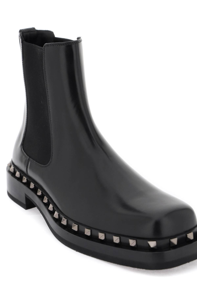Shop Valentino Rockstud M-way Ankle Boots In Black