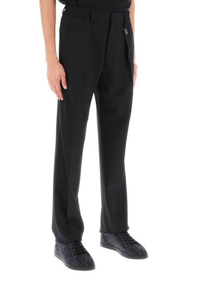 Shop Fendi Loose-fit Tapered Pants In Black