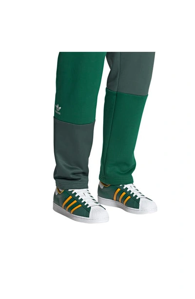 Shop Adidas Originals Superstar Lifestyle Sneaker In Green/ Crew Yellow/ White