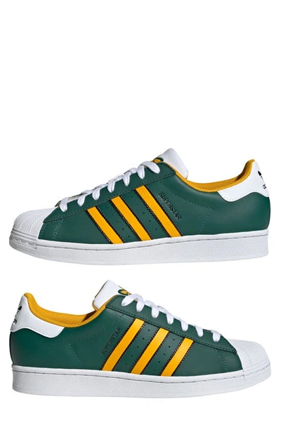 Shop Adidas Originals Superstar Lifestyle Sneaker In Green/ Crew Yellow/ White