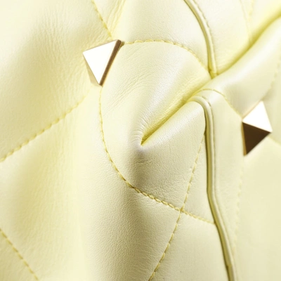 Shop Valentino Garavani Roman Stud Yellow Leather Tote Bag ()