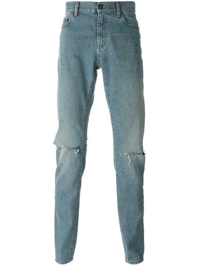Shop Saint Laurent Stonewashed Jeans In Blue