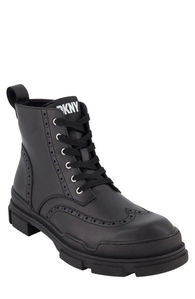 Shop Dkny Wingtip Lug Boot In Black
