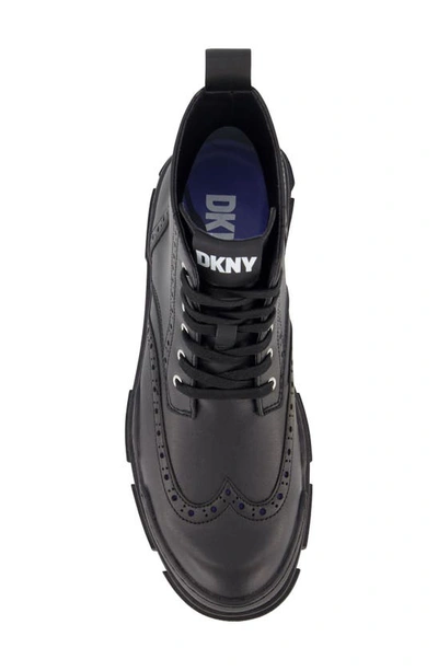 Shop Dkny Wingtip Lug Boot In Black