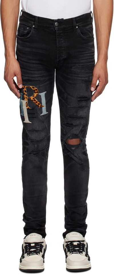 Shop Amiri Black Staggered Jeans In Faded Black
