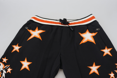 Shop Dolce & Gabbana Black Orange Star Trousers Sport Men's Pants