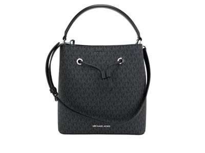 Shop Michael Kors Suri Large Signature Pvc Convertible Bucket Bag To Backpack Bag (black Women's Signatur
