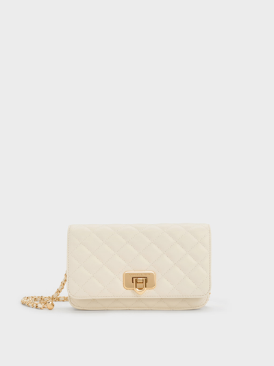 Shop Charles & Keith Cressida Quilted Push-lock Clutch In Cream