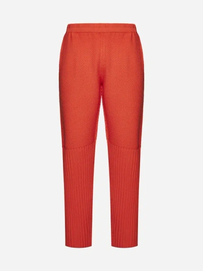 Shop Issey Miyake Cotton-blend Knit Trousers In Powerful Orange