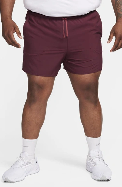 Shop Nike Dri-fit Stride 5-inch Running Shorts In Night Maroon/ Cedar