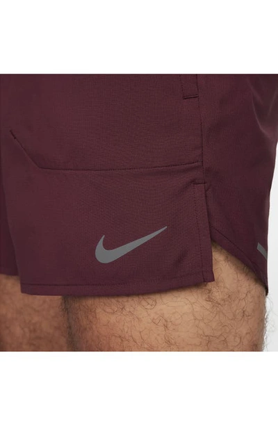 Shop Nike Dri-fit Stride 5-inch Running Shorts In Night Maroon/ Cedar
