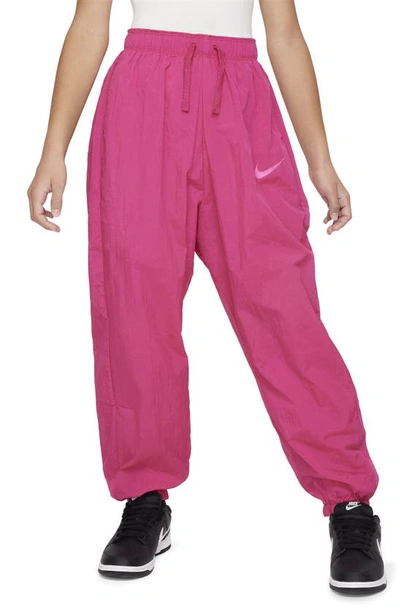 Shop Nike Kids' Sportswear Side Stripe Track Pants In Fireberry/ Laser Fuchsia
