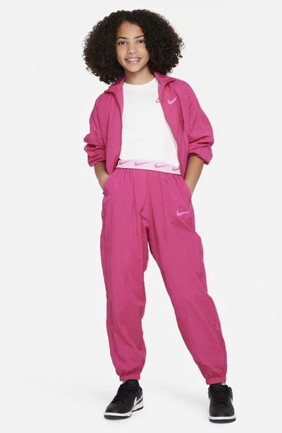 Shop Nike Kids' Sportswear Side Stripe Track Pants In Fireberry/ Laser Fuchsia