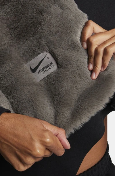 Shop Nike Swoosh Faux Fur Throw Blanket In Flat Pewter/ Black