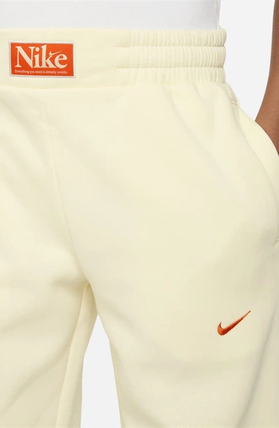 Shop Nike Kids' Fleece Basketball Joggers In Coconut Milk/ Safety Orange