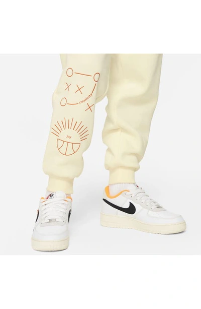 Shop Nike Kids' Fleece Basketball Joggers In Coconut Milk/ Safety Orange