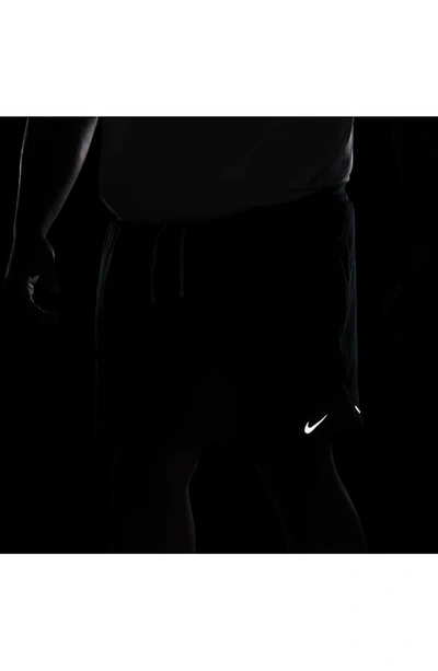 Shop Nike Dri-fit Stride 2-in-1 Running Shorts In Deep Jungle/ Black/ Green