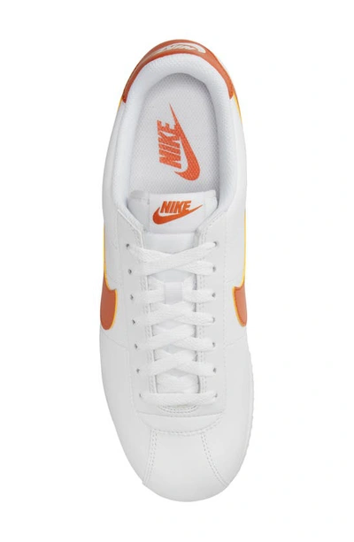 Shop Nike Cortez Sneaker In White/ Campfire Orange/ Jade
