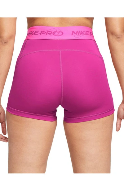 Shop Nike Pro Mid Rise Graphic Training Shorts In Fire Berry/ Laser Fuchsia
