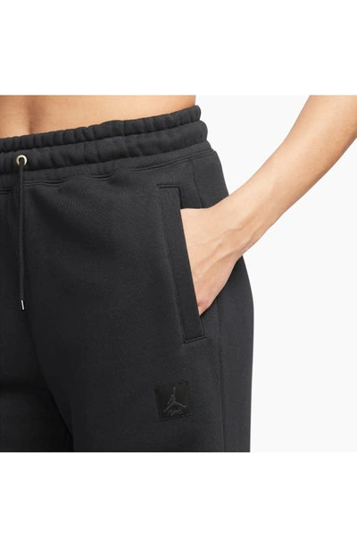 Shop Jordan Fleece Pants In Black