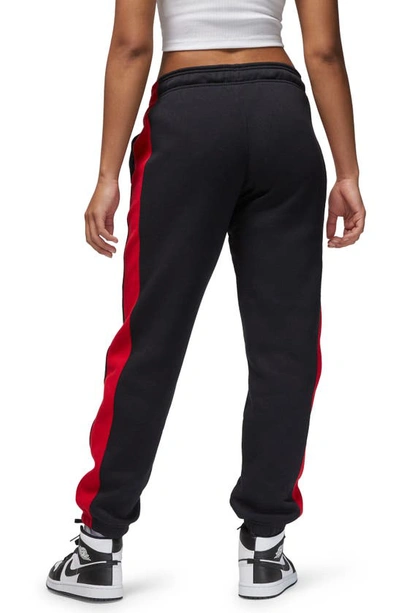 Shop Jordan Brooklyn Fleece Sweatpants In Black/ Gym Red/ White