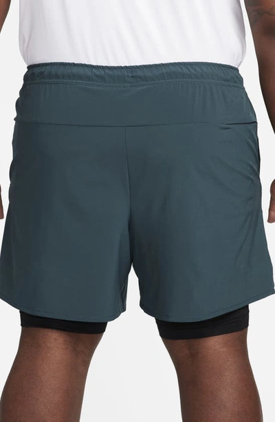 Shop Nike Dri-fit Unlimited 2-in-1 Versatile Shorts In Deep Jungle/ Black