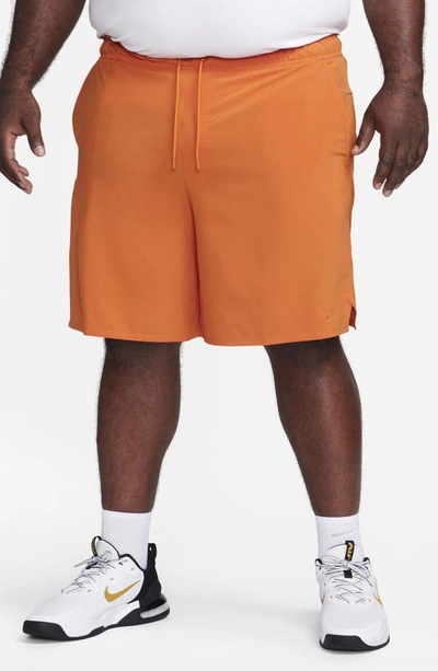 Shop Nike Dri-fit Unlimited Training Shorts In Campfire Orange