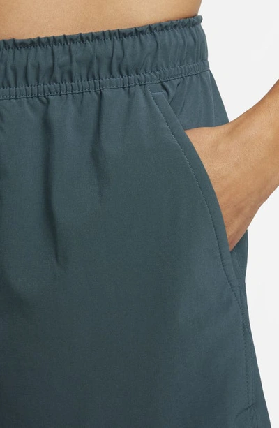 Nike Men's Unlimited Dri-fit 9" Unlined Versatile Shorts In Deep Jungle/ Deep Jungle