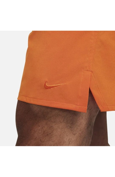Shop Nike Dri-fit Unlimited Training Shorts In Campfire Orange