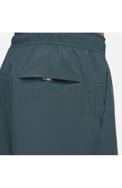 Nike Men's Unlimited Dri-fit 9" Unlined Versatile Shorts In Deep Jungle/ Deep Jungle