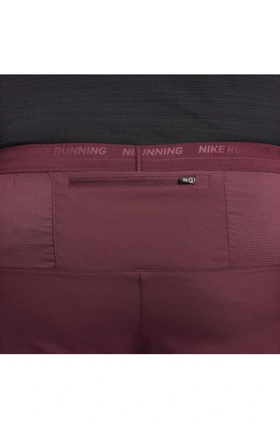 Shop Nike Dri-fit Stride Hybrid Running Shorts In Night Maroon/ Black/ Cedar