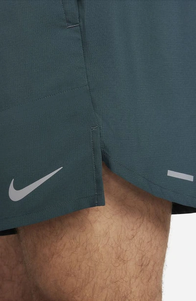 Shop Nike Dri-fit Stride 7-inch Brief-lined Running Shorts In Deep Jungle/ Luminous Green