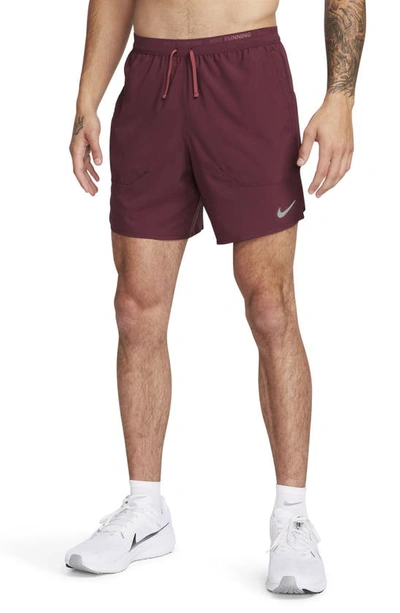 Shop Nike Dri-fit Stride 7-inch Brief-lined Running Shorts In Night Maroon/ Cedar