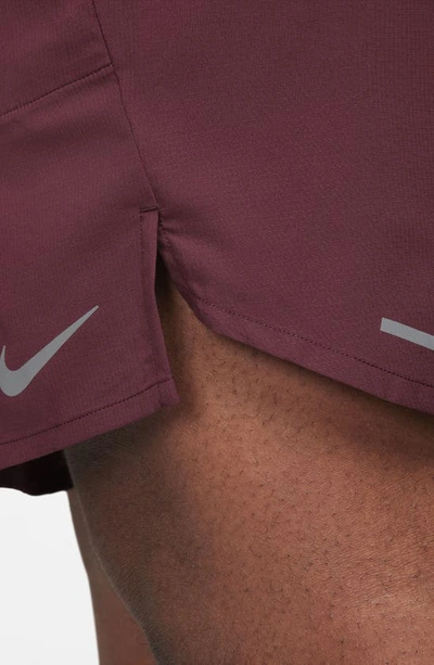 Shop Nike Dri-fit Stride 7-inch Brief-lined Running Shorts In Night Maroon/ Cedar