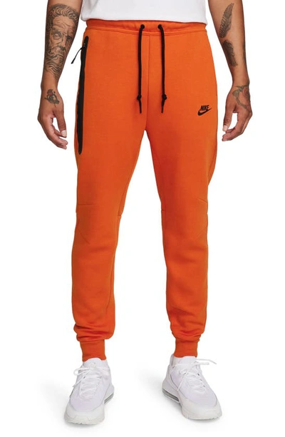 Shop Nike Tech Fleece Joggers In Campfire Orange/ Black