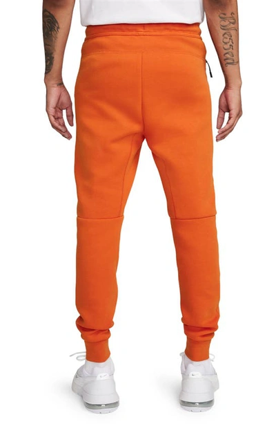 Shop Nike Tech Fleece Joggers In Campfire Orange/ Black