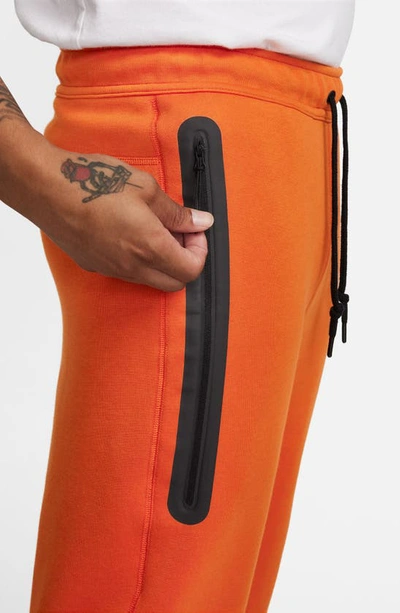 Shop Nike Tech Fleece Joggers In Campfire Orange/ Black