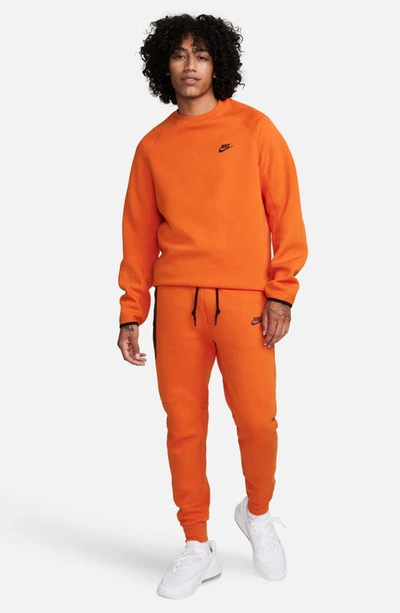 Shop Nike Tech Fleece Joggers In Campfire Orange/ Black