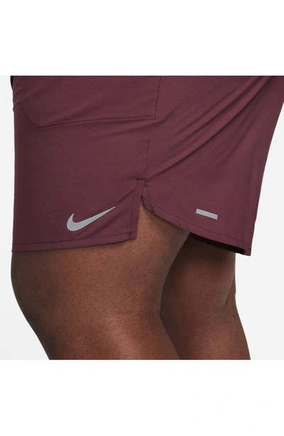Shop Nike Dri-fit Stride Unlined Running Shorts In Night Maroon/ Cedar
