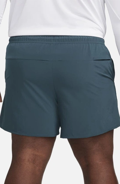 Shop Nike Dri-fit Unlimited 5-inch Athletic Shorts In Deep Jungle/ Deep Jungle