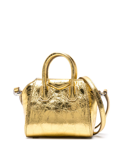 Shop Givenchy Antigona Micro Leather Crossbody Bag In Gold