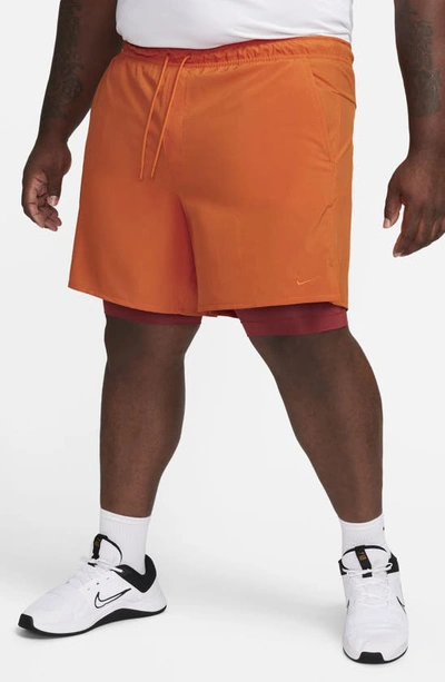 Shop Nike Dri-fit Unlimited 2-in-1 Versatile Shorts In Campfire Orange/ Rugged Orange