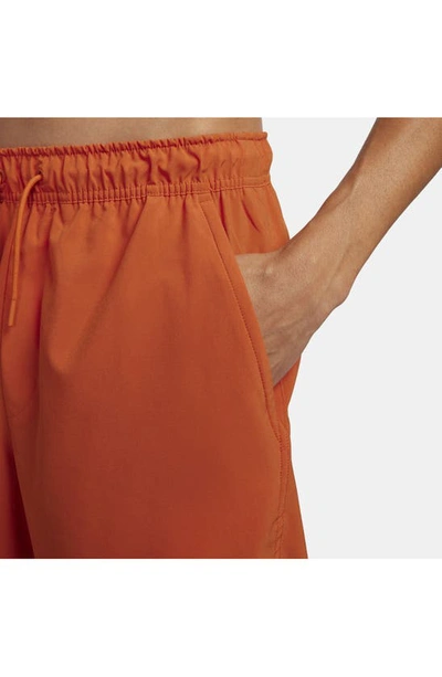 Shop Nike Dri-fit Unlimited 2-in-1 Versatile Shorts In Campfire Orange/ Rugged Orange