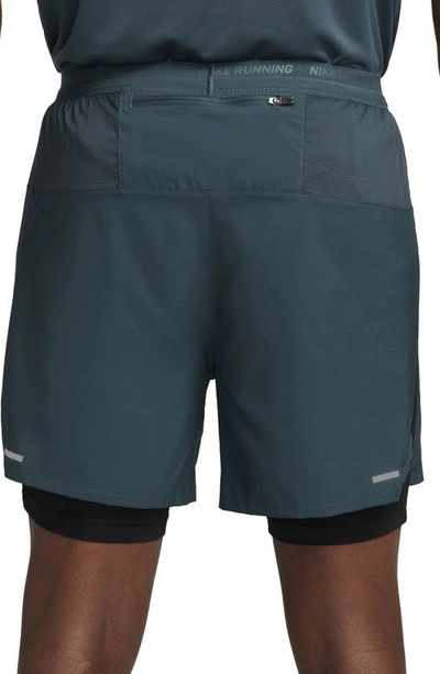 Shop Nike Dri-fit Stride Hybrid Running Shorts In Deep Jungle/ Black/ Green