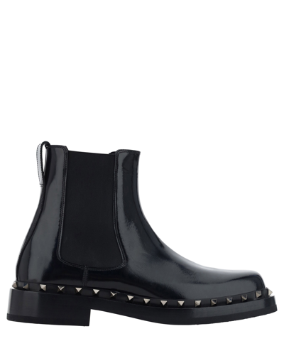 Shop Valentino Rockstud Ankle Boots In Black