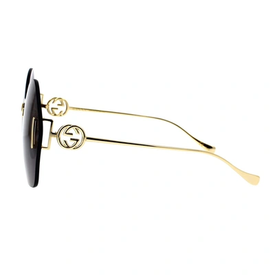 Shop Gucci Eyewear Sunglasses In Gold